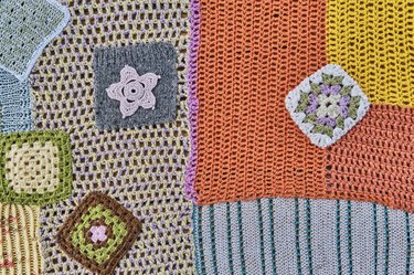 Colourful patchwork abstract background. Different pieces, knitted and crocheted are into one canvas