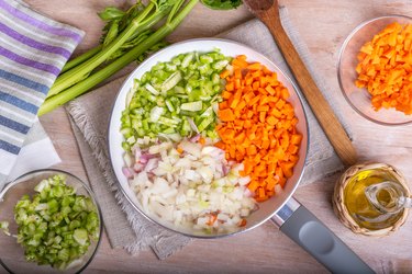 Cooking carrot, celery and onion in a skillet