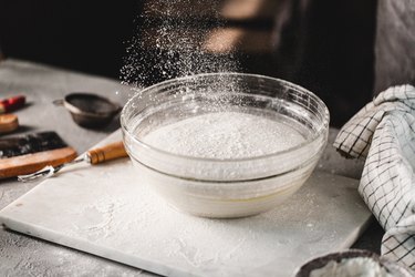 Flour in a mixing bowl for making sourdough bread in kitchen