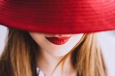 Beautiful fair-haired woman with lips painted red lipstick