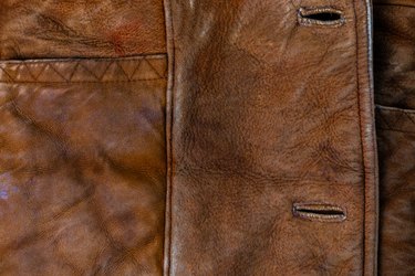Small brown thick seude jacket closeup texture with selective focus
