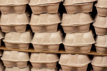 Dozen eggs carton cardboard boxes piled