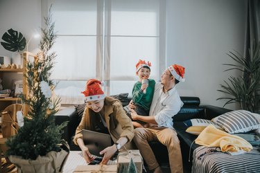 Asian family having small party at home on Christmas Day-stock photo