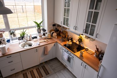 Festive Christmas decor and mess in the kitchen, cooking treats for the feast. New Year, mood, home interior