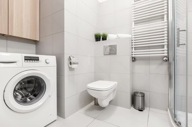 Bathroom with washer and shower