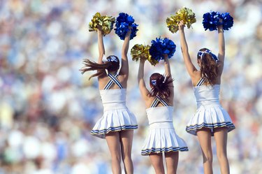 Caucasian cheerleaders posing together