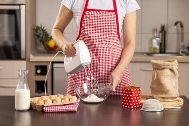 Woman using a kitchen mixer