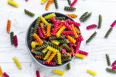 Bowl of colorful dry pasta