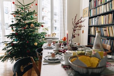 christmas breakfast table in front of christmas tree