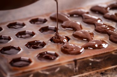 Molded chocolate can be kept from sticking to candy molds with just a little effort.