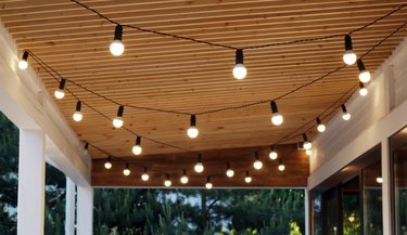 Lights hanging from ceiling of porch