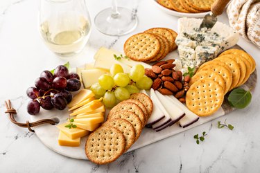 Cheese board with crackers,Nuts and grapes