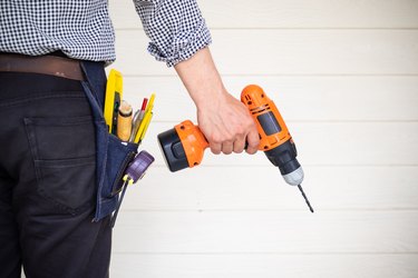 Man Holding Drill