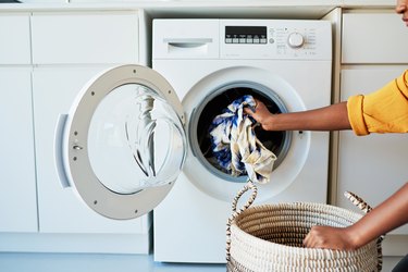 Putting clothes in washing machine