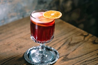 red mulled wine decorated with dried orange on the table in the bar