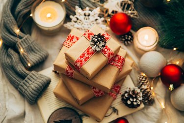 Stack of Christmas gifts, decorations and knitted sweater