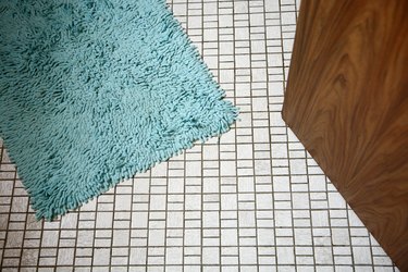 Bathroom floor with blue mat