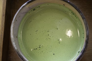 Matcha added to warmed milk