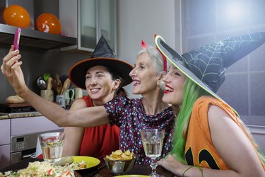Women Pose for Selfie, dressed up for Halloween.