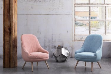 Pastel colored armchairs with coffee table