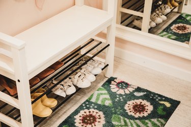Shoe rack with different size shoes showing the concept of family