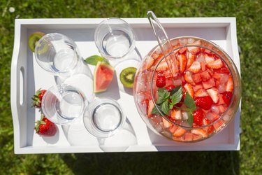 Watermelon strawberry kiwi punch in a bowl on tray