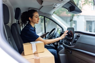 Delivery person using car GPS to determine customer's address