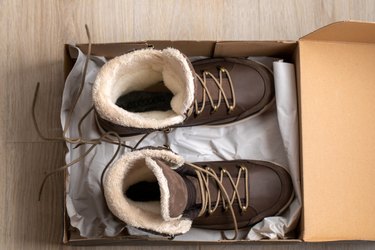 new brown leather insulated winter boots with membrane and fur. in box top view