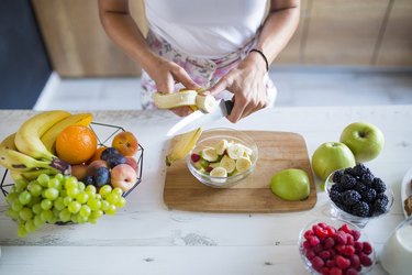 Preparing a fruit bowl for breakfast