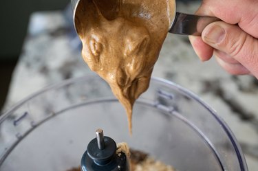 Peanut Butter being poured into Blender