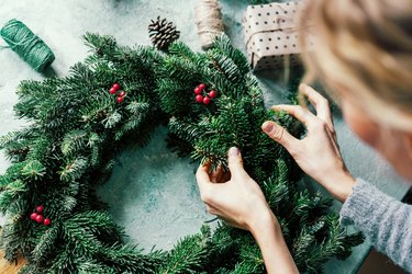 woman making a fir wreath