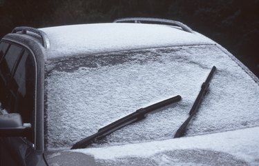 High Angle View Of Snow Covered Car