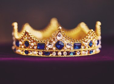 Gold jeweled crown on velvet
