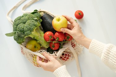 Fresh fruit and vegetables in a reusable produce bag