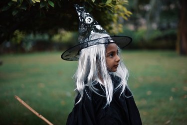 Girl dressed as a witch on the Halloween day