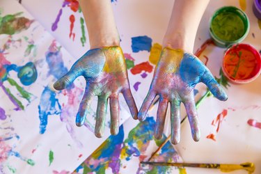 Girl playing with finger paint