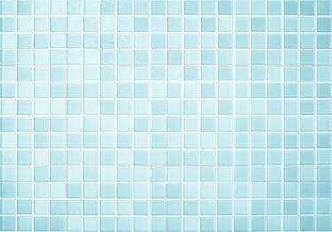 Blue checkered ceramic wall and floor tiles form a mosaic background in the bathroom or kitchen