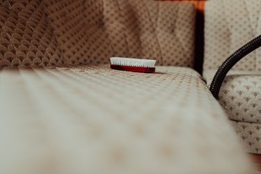 close up furniture cleaning brush on the sofa