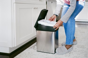 Woman Replaces Kitchen Trash Bag