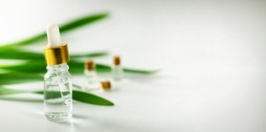 essential oil bottle on white background with copy space