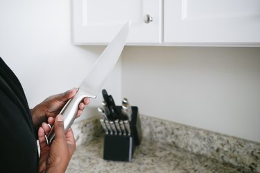 Woman Holds Kitchen Knife