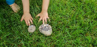 small rocks decorated with faces