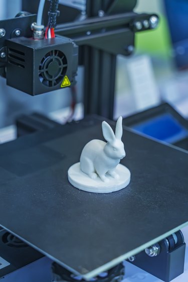 rabbit closeup object printed 3d printer close-up. Progressive modern additive technology 4.0 industrial revolution