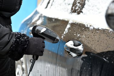 Defrosting a car lock with a hair dryer