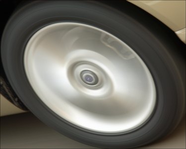 Spinning hubcap of a car, close-up