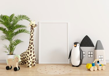 Empty picture frame mockup in child room, 3D rendering