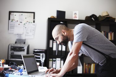 portrait of a young man working at his laptop