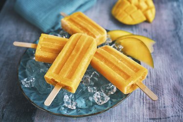 Mango popsicle on ice