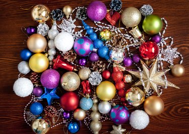 Christmas balls and a star on the table. Christmas collection of New Year decorations. Christmas background with balls.