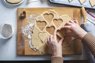 Preparing heart sugar cookies.